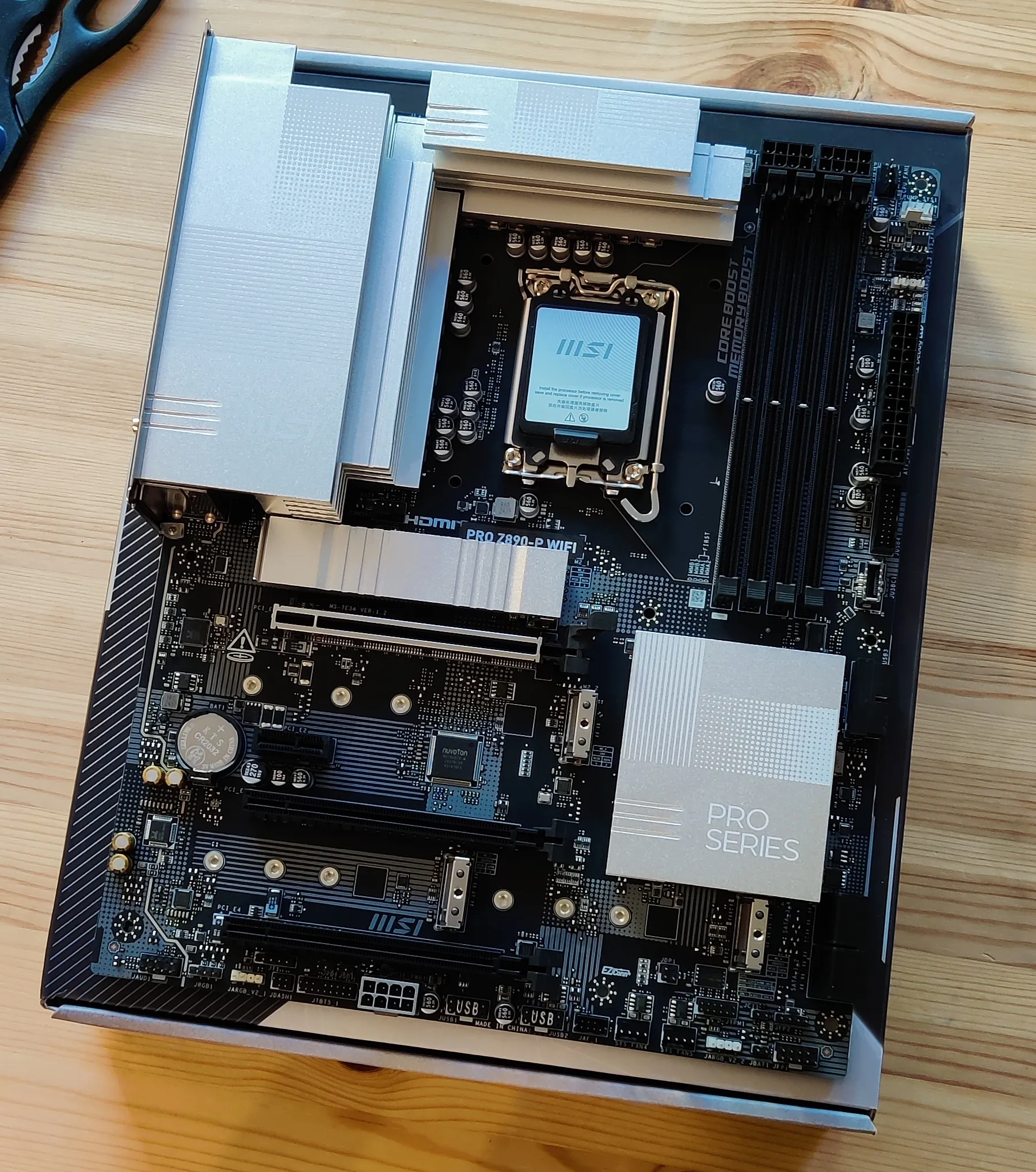 A computer motherboard on a kitchen table
