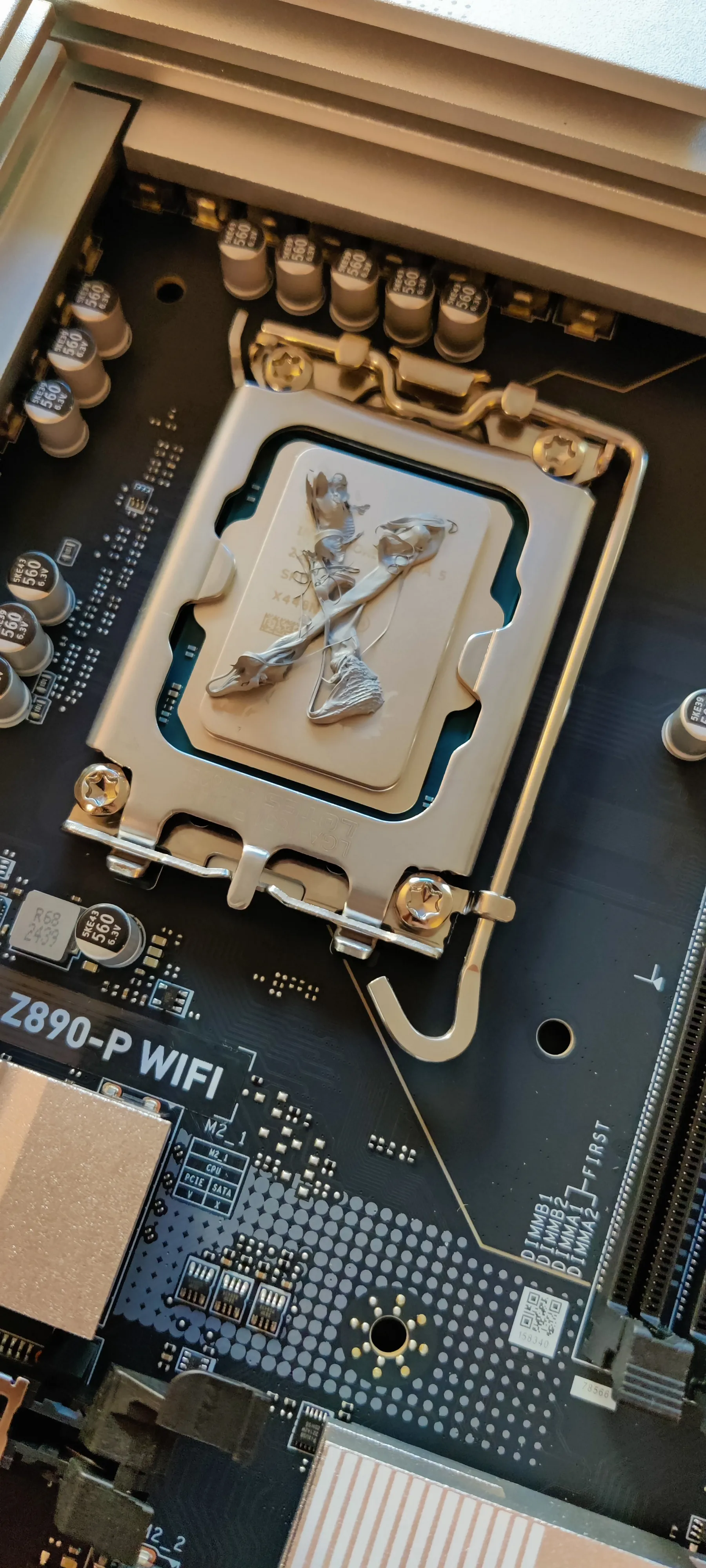 Thermal paste applied to a CPU in a motherboard