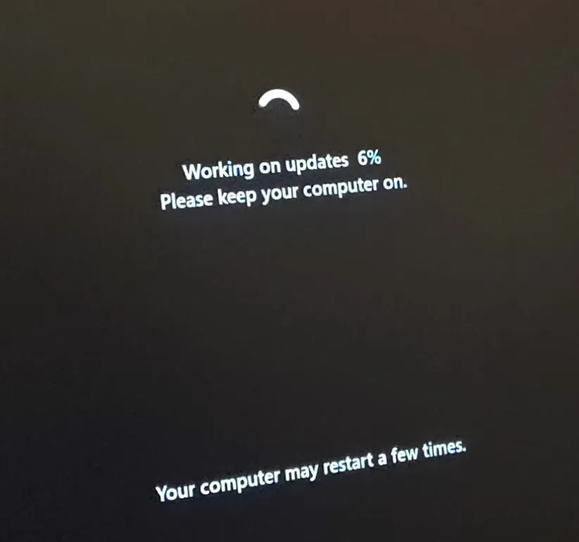 A photo of a computer display updating Windows