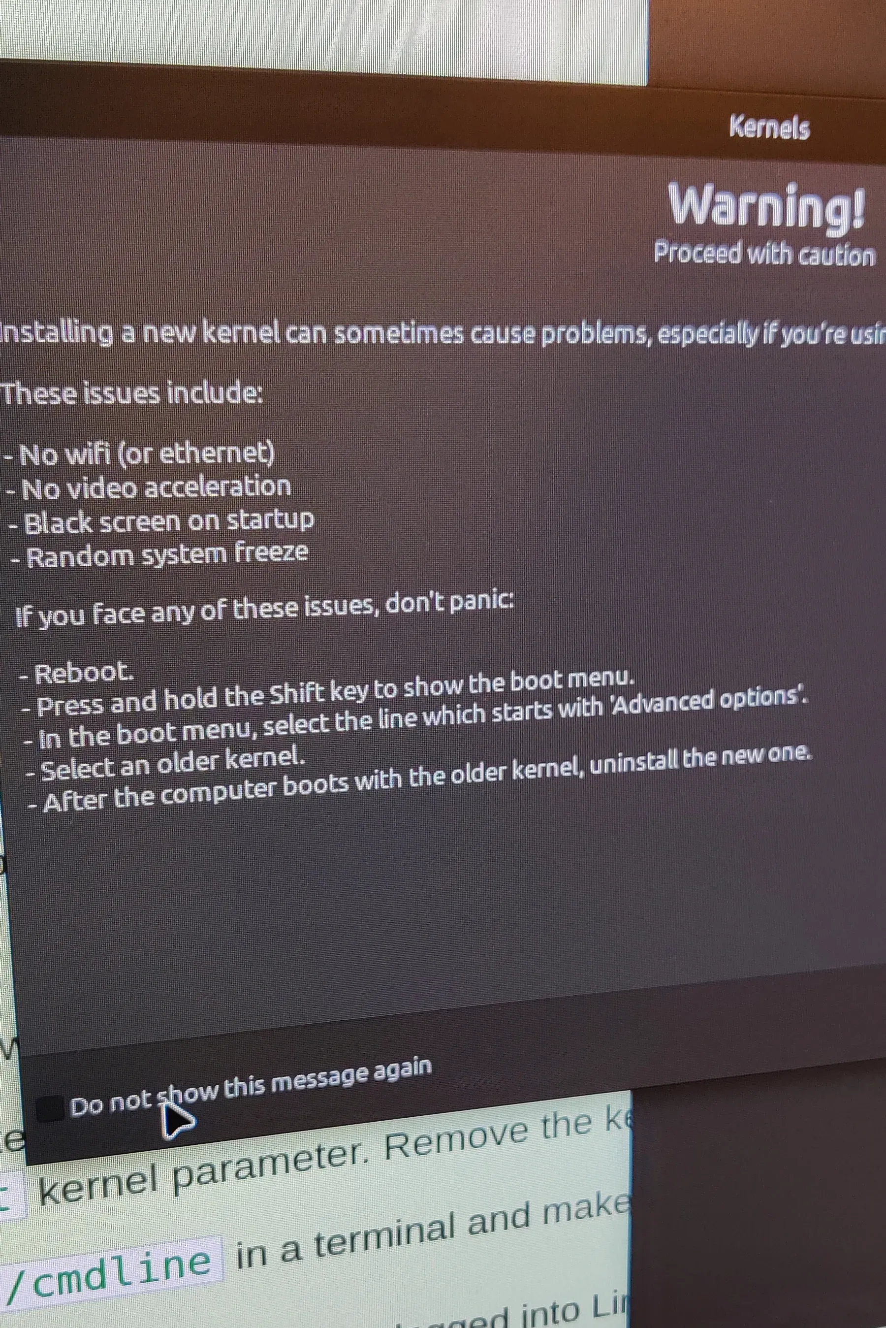 A photo of a computer display with a 'new kernel' warning