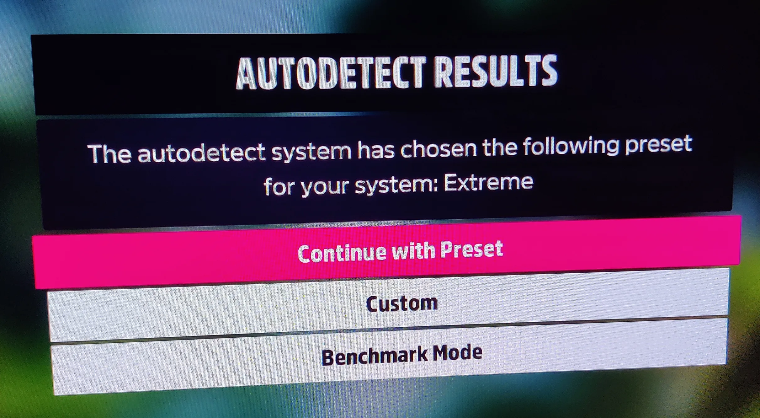 Photo of computer display with text "Autodetect results: Extreme"